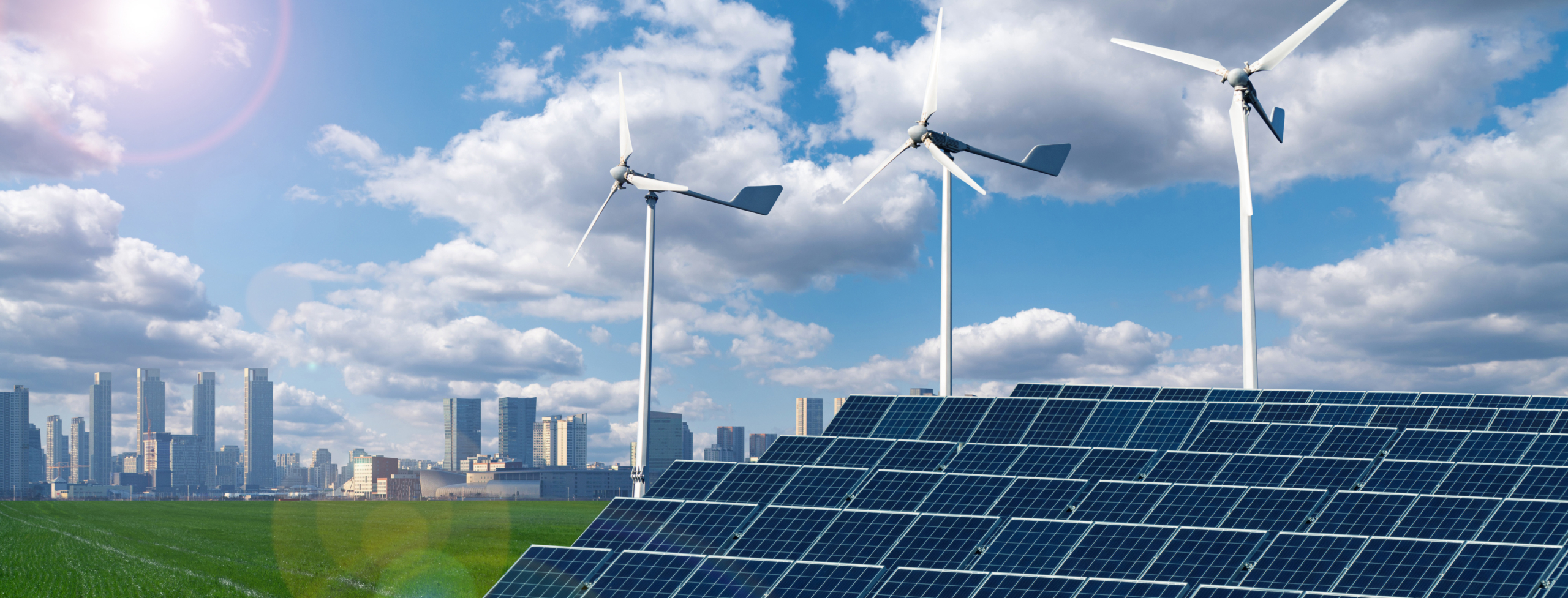 Wind turbines and solar panels on the green field